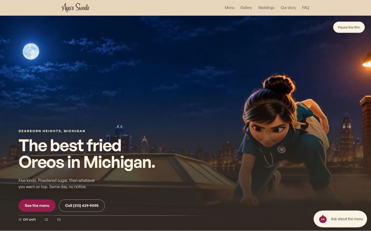 The Aya's Sweets homepage on a desktop: a night skyline over Detroit, the headline 'The best fried Oreos in Michigan', a See the menu button and her phone number.